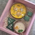 1 Rasmalai candle, 2 Sutli bombs, 1 Small wooden urli, 2 Paan candles